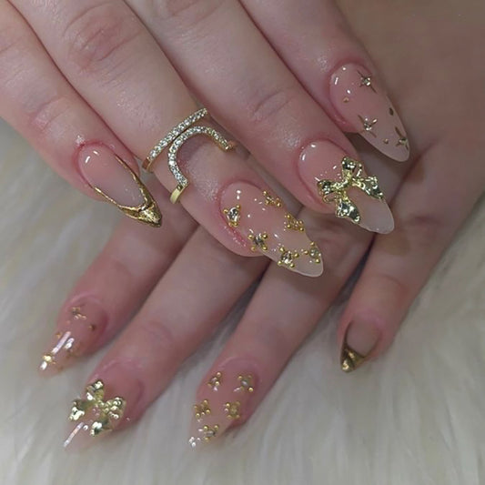Glamorous Elegance Long Almond Shaped Beige with Gold Accents and Glittering Bow Details Press On Nail Set