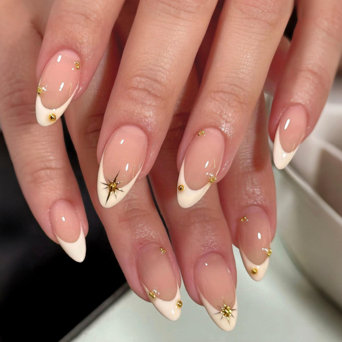 Celestial Charm Medium Almond Ivory Nail Set with Glamorous Gold Accents