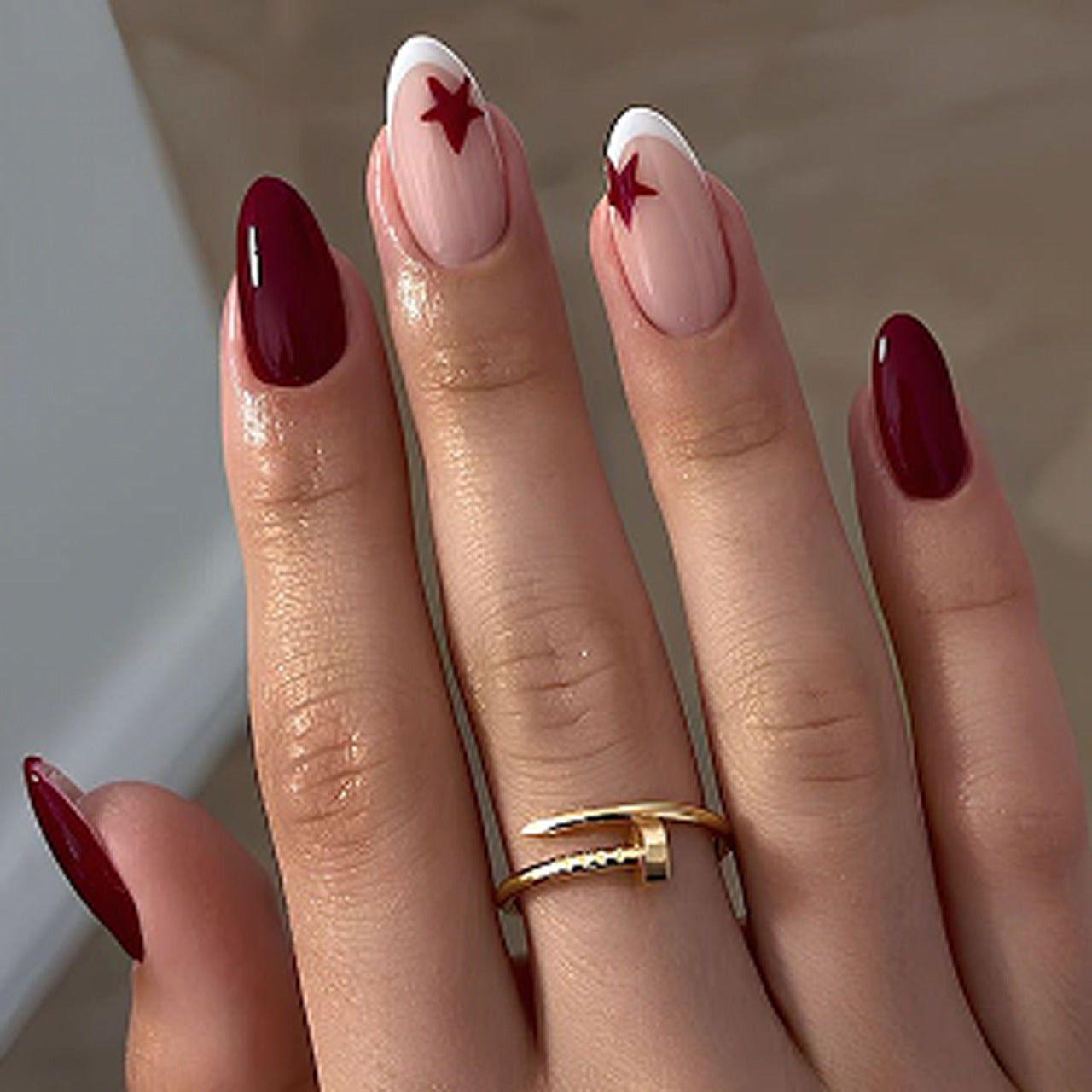Celestial Glamour Medium Almond Burgundy Nails with Star Accents