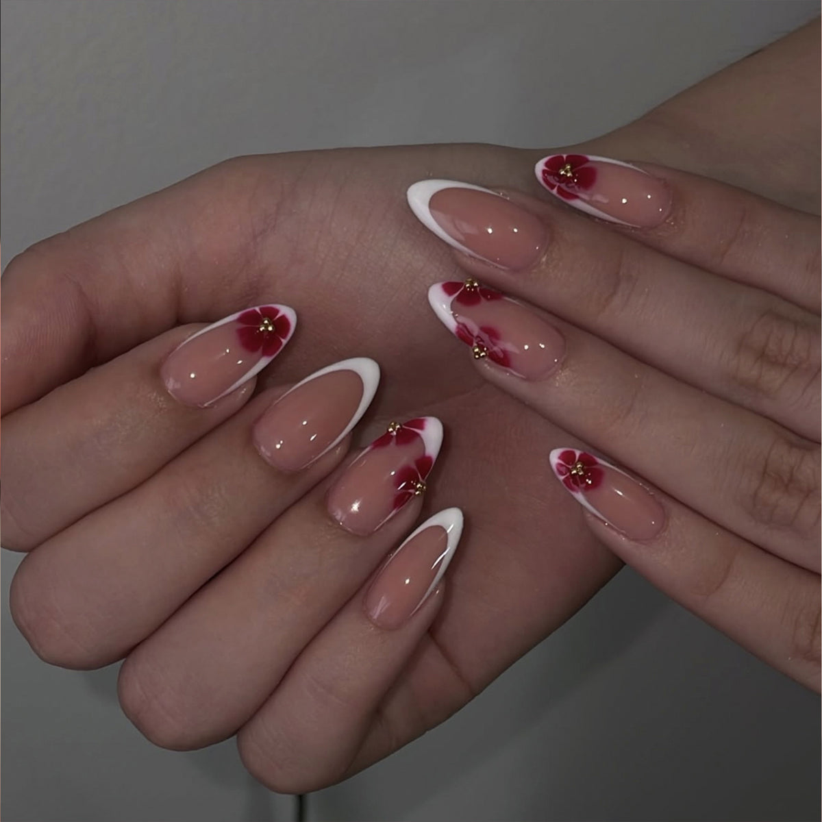 Floral Elegance Medium Almond Pink and White French Tip Design with Glitter Accents