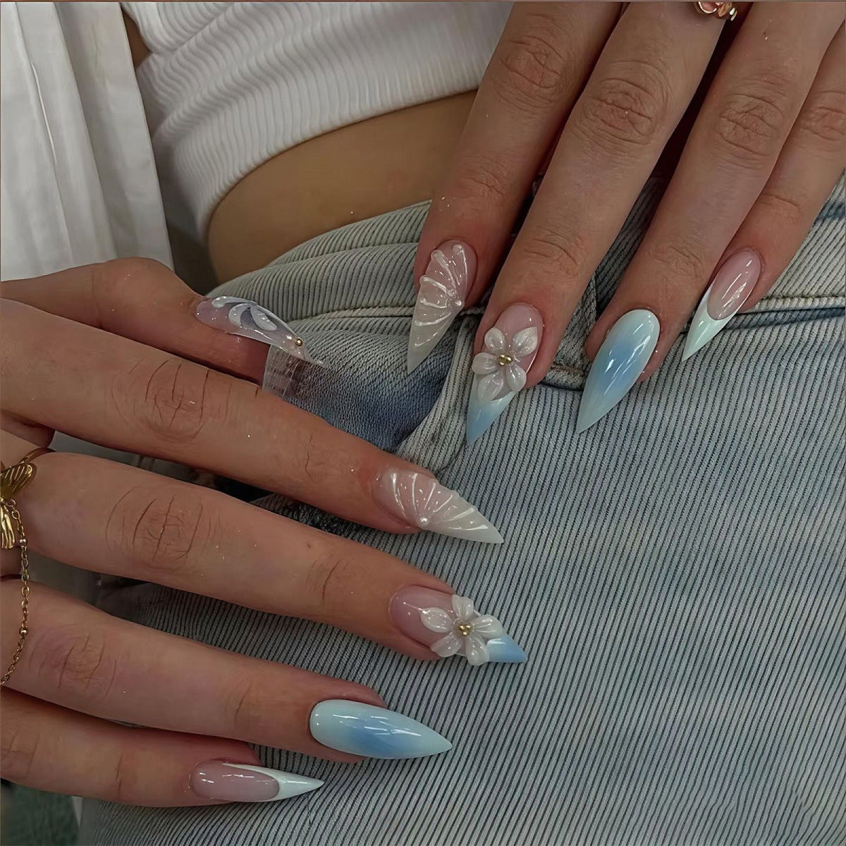 Whimsical Spring Inspired Long Stiletto Blue Ombre Nails with Floral Accents