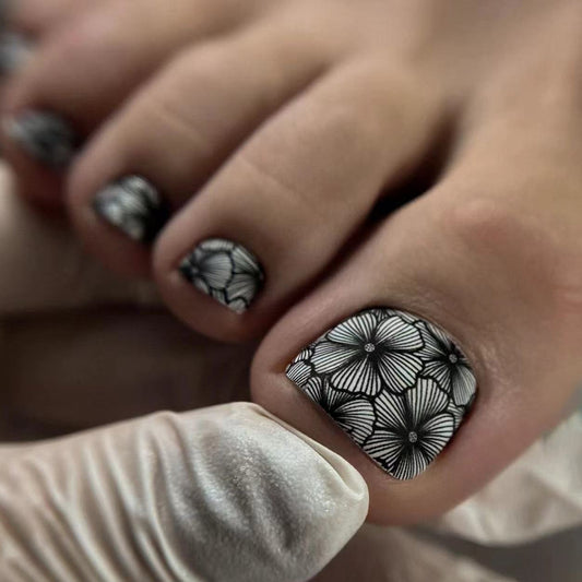 Floral Elegance Short Round Black and White Press On Nails with Intricate Petal Design