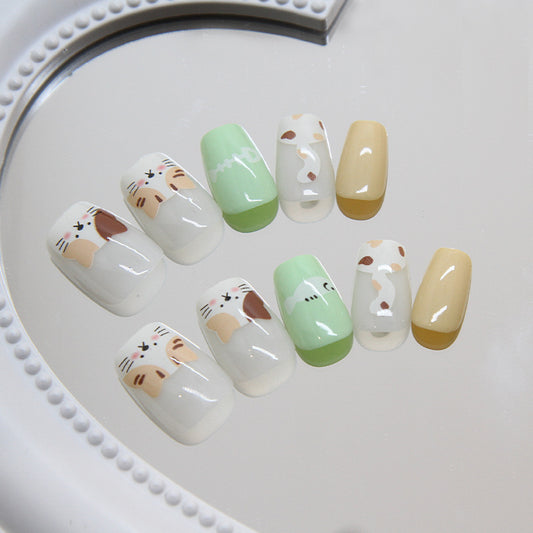 Whimsical Cat-Themed Short Round Press On Nail Set in Pastel Green and Cream with Adorable Feline Faces Design