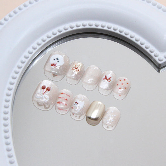 Whimsical Winter Pastel Short Squoval Press On Nail Set with Glitter Accents and Cute Character Designs