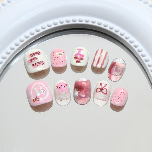 Whimsical Blossom Pink Short Squoval Press On Nail Set with Playful Rabbit Designs and Shimmering Finish