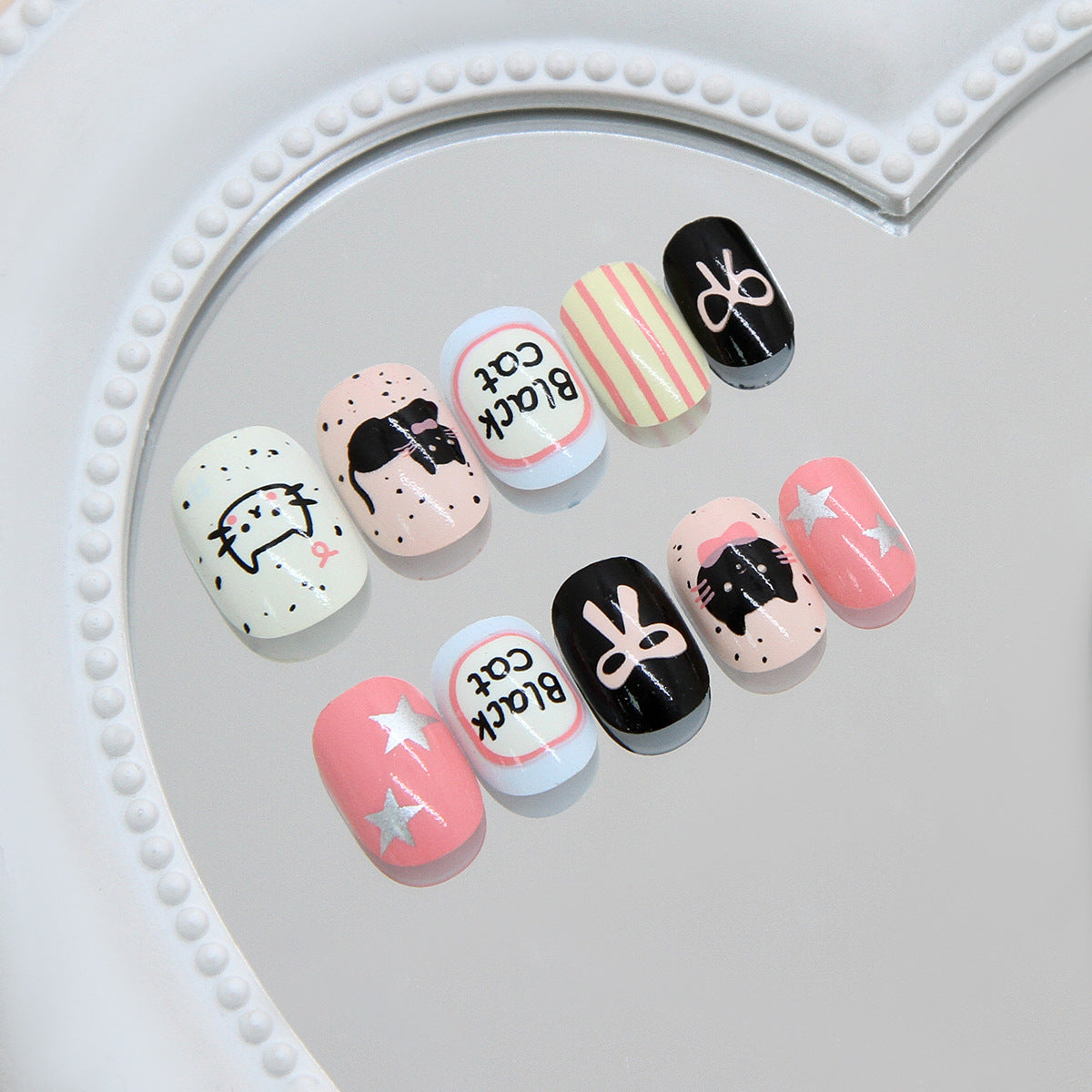 Whimsical Cat Kingdom Short Oval Pink and Black Press-On Nail Set with Artistic Designs