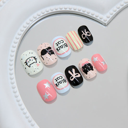 Whimsical Cat Kingdom Short Oval Pink and Black Press-On Nail Set with Artistic Designs
