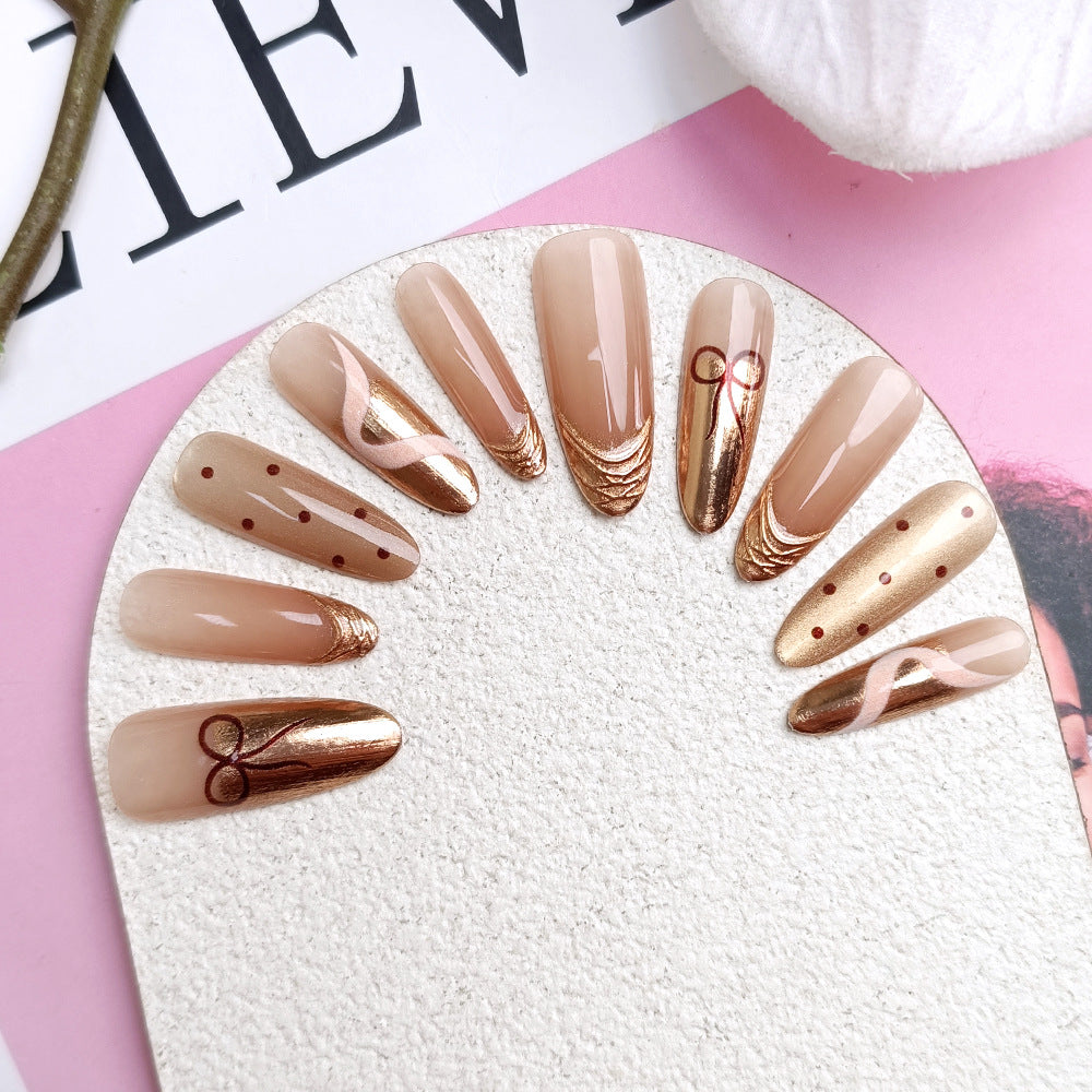 Glamorous Rose Gold Long Almond Press On Nail Set with Unique Artistic Design
