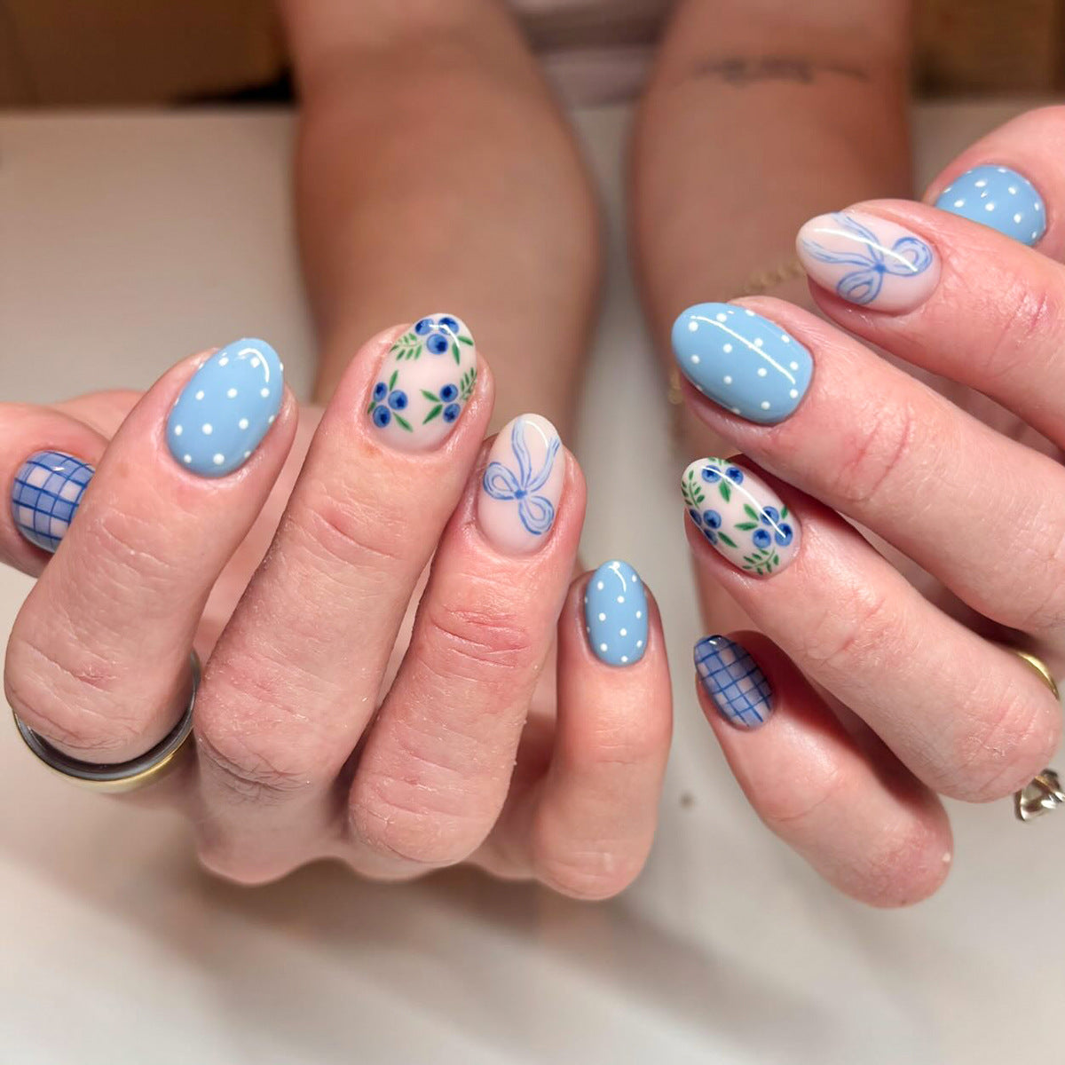 Whimsical Beauty Short Oval Sky Blue Press On Nail Set with Floral and Geometric Designs