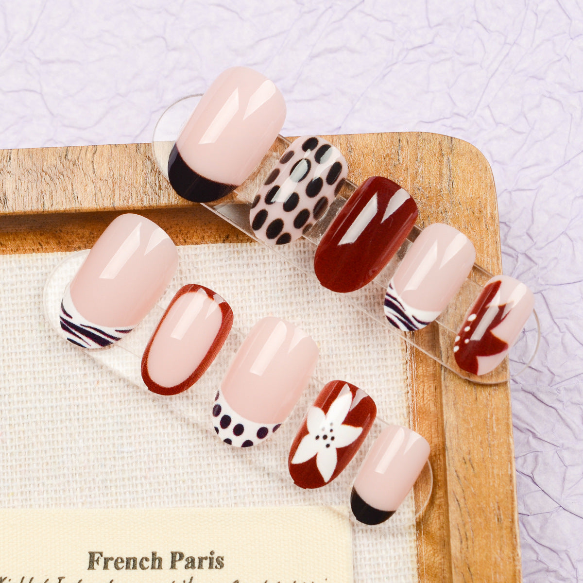 Chic Parisian Elegance Glossy Medium Oval Pink and Burgundy Nail Set with Artistic Floral and Polka Dot Designs