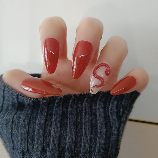Chic Elegance Long Almond Red Nail Set with Unique Swirl Accent