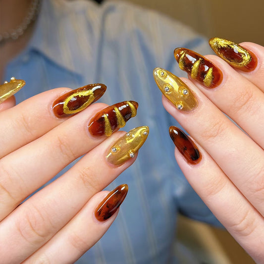 Golden Autumn Elegance Dreamy Long Almond Shaped Brown and Gold Press On Nail Set with Unique Textured Design and Gem Accents