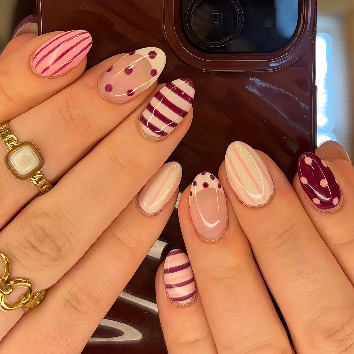 Whimsical Pink Medium Almond Press On Nail Set with Unique Polka Dot Design