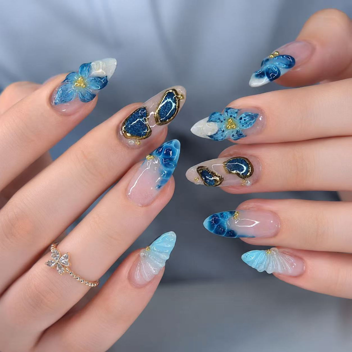 Ocean Breeze Medium Almond Blue Floral Press-On Nail Set with Unique Gold Accents