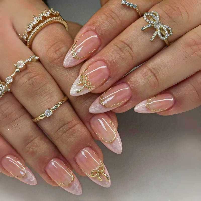 Chic Elegance Long Almond Blush Pink With Dazzling Gold Bow Accents Nail Set