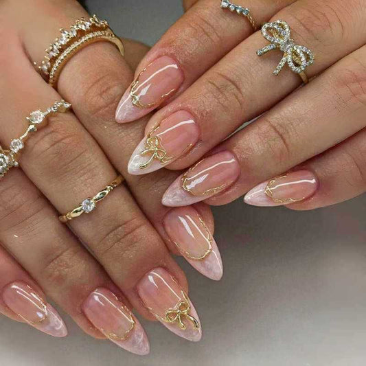 Chic Elegance Long Almond Blush Pink With Dazzling Gold Bow Accents Nail Set