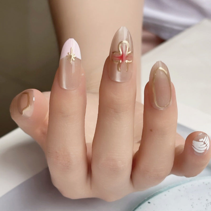 Whimsical Elegance Long Almond Shaped Beige and Pastel Press on Nail Set with Intricate Gold and Floral Accents