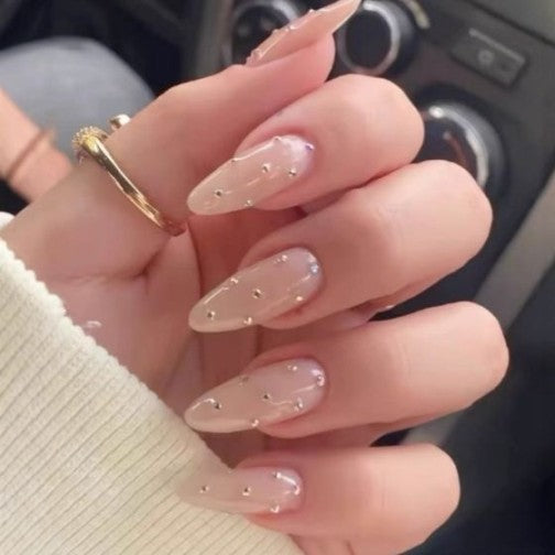 Elegant Charm Long Almond Shaped Beige Nails with Dazzling Rhinestone Accents