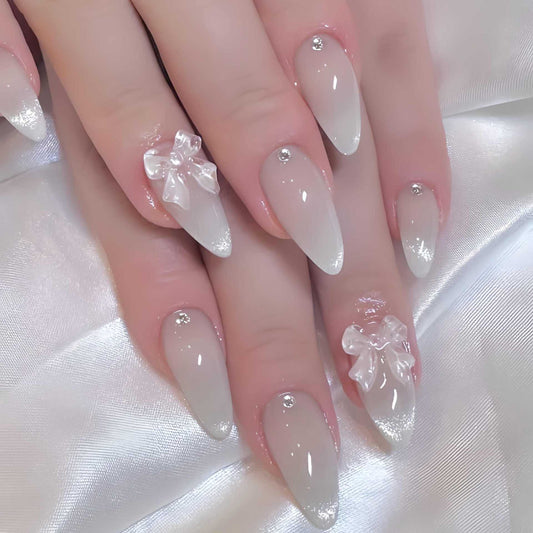Glamorous Fairytale Long Stiletto Press On Nails in Frosted White with Charming Bow and Sparkling Accents