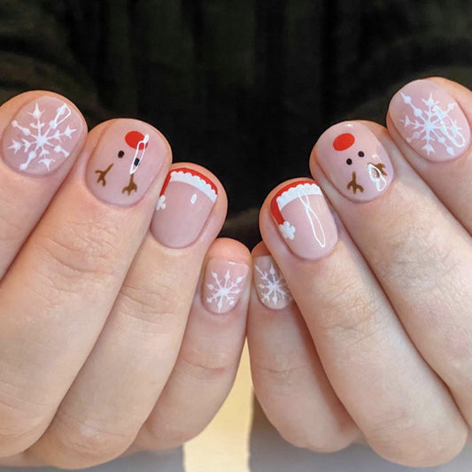 Festive Short Squoval Beige Nails with Snowflake and Reindeer Design