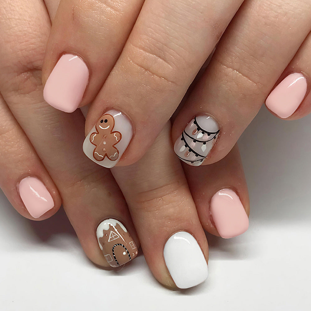 Festive Short Square Pink Press On Nail Set with Gingerbread and Holiday Lights Design