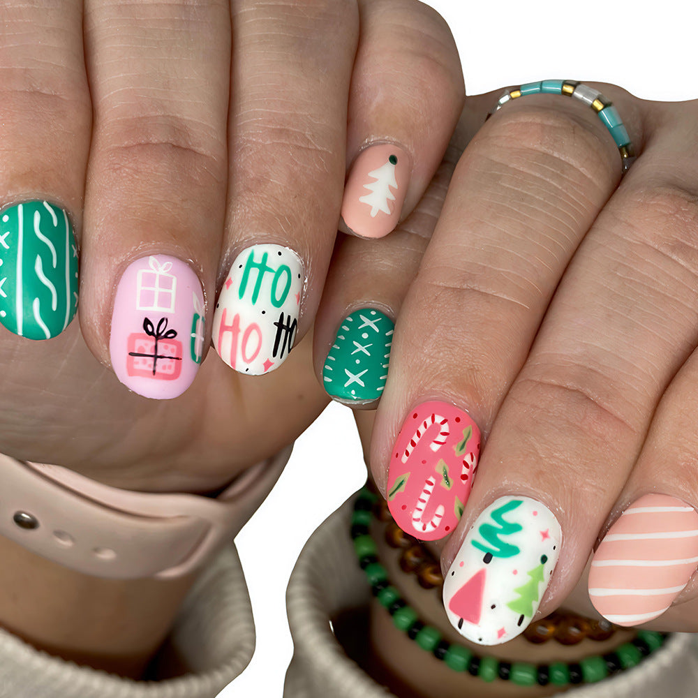 Festive Green and Pink Short Round Press On Nail Set with Unique Holiday Themed Designs