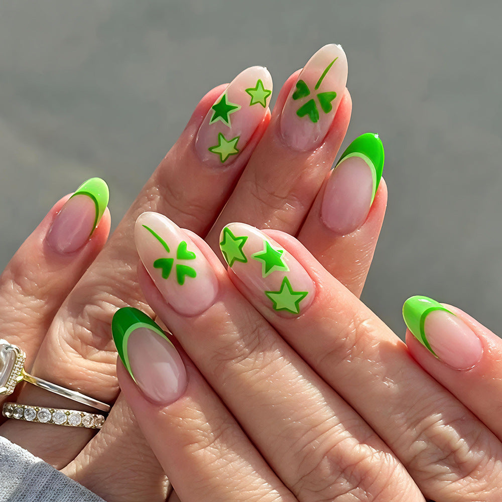 Starlit Elegance Long Almond Green French Tip Nail Set with Unique Star and Leaf Design