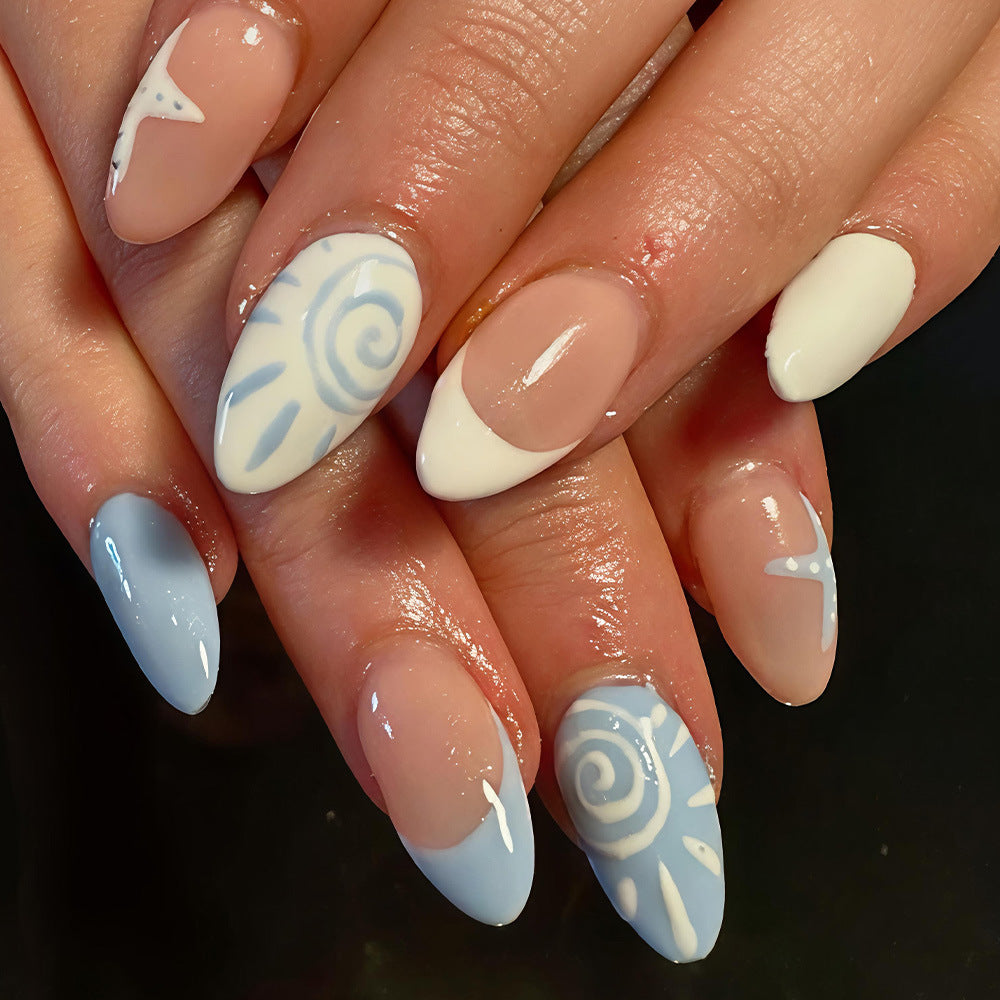 Ocean Breeze Medium Almond Blue and White Nail Set with Unique Artistic Design