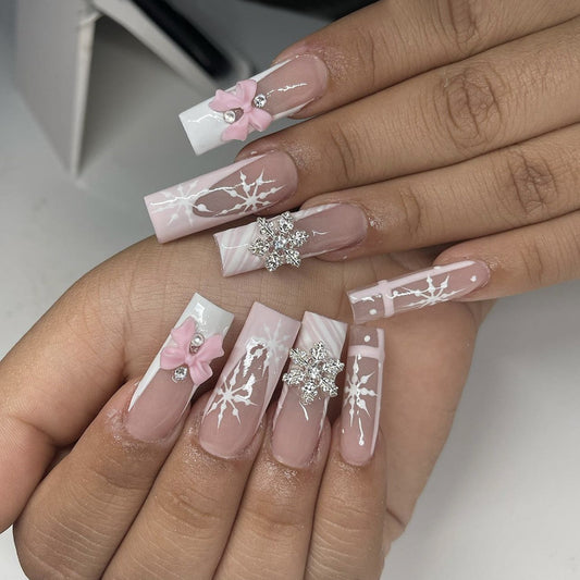 Charming Winter Wonderland Long Square Pink and White Press-On Nail Set with Decorative Bows and Sparkling Snowflakes