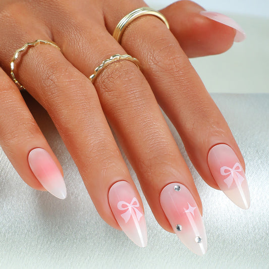 Chic Elegance Long Almond Pale Pink Press On Nail Set with Rhinestone Accents and Bow Designs