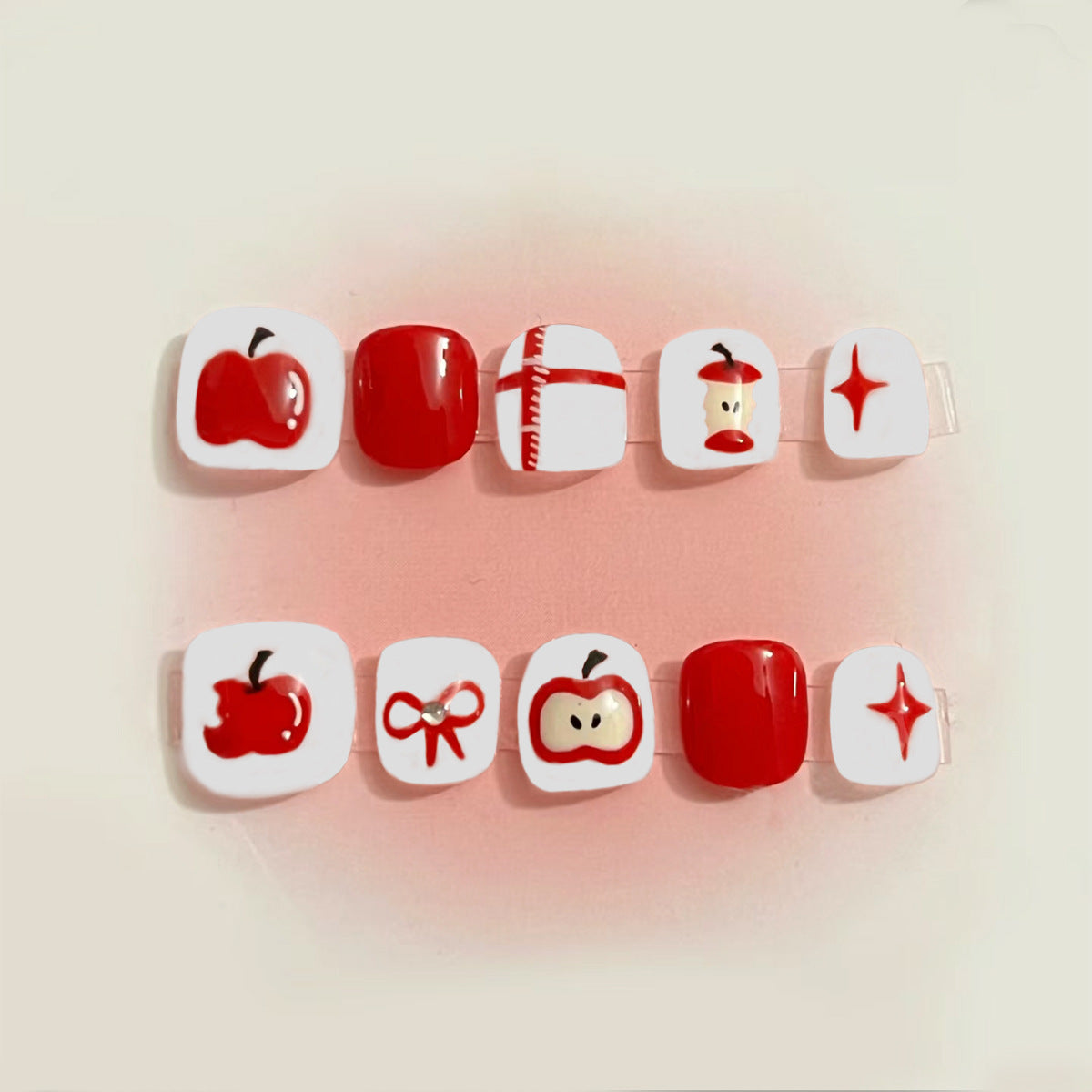Set of nail art designs on a beige background
