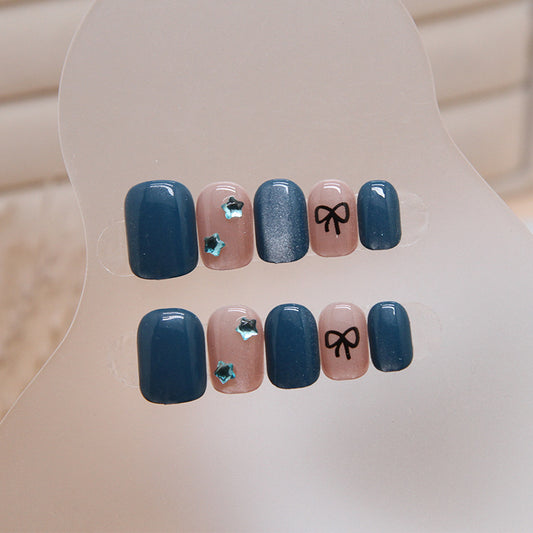 Starry Night Elegance Short Round Midnight Blue and Soft Pink Press On Nail Set with Glitter Accent and Bow Design