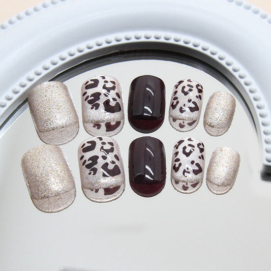 Wild Safari Glamour Leopard Print Short Square Shaped Shimmering Gold and Deep Burgundy Press-On Nail Set with Unique Textured Design