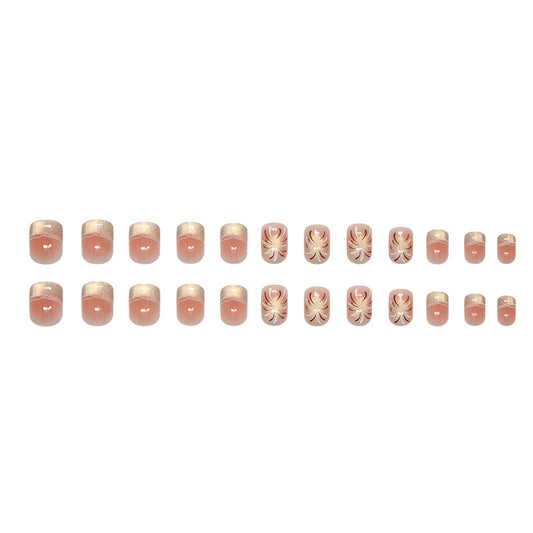 A set of square-shaped, pink false nails with a floral pattern.