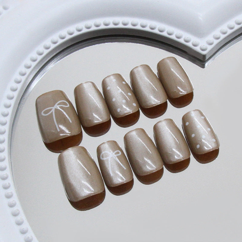 Chic Celebration Elegant Short Square Neutral Beige Nails with Whimsical Bow and Polka Dot Design