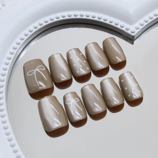 Chic Celebration Elegant Short Square Neutral Beige Nails with Whimsical Bow and Polka Dot Design