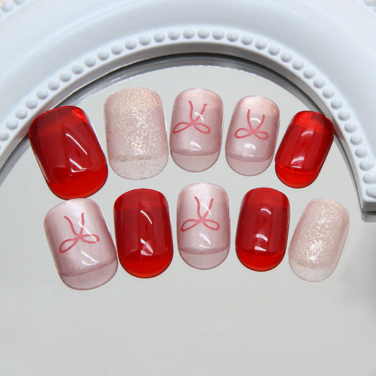 Whimsical Charm Short Squoval Red and Beige Press On Nail Set with Delicate Bow Design