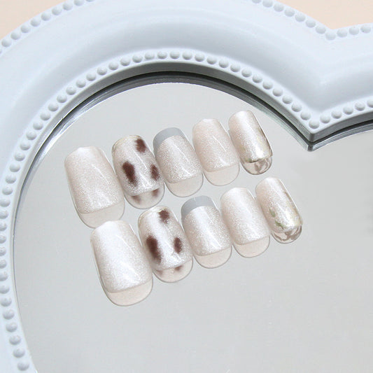 Enchanting Elegance Short Squoval Creamy White Press-On Nail Set with Stunning Glossy Finish and Unique Spot Design