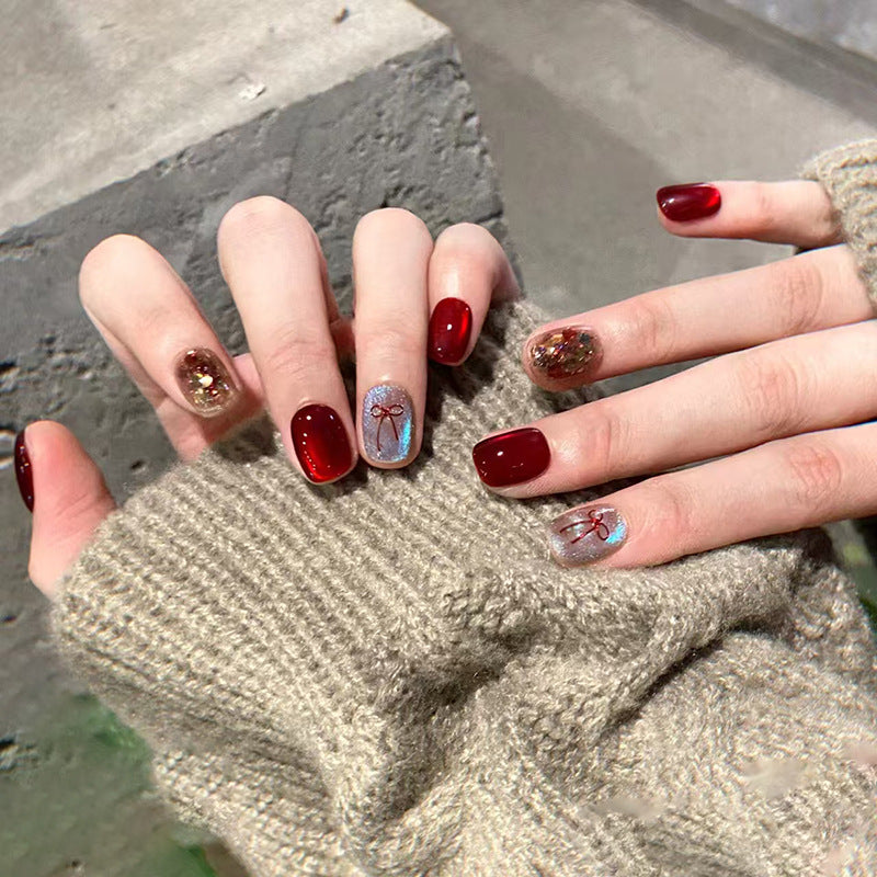 Glamorous Autumn Palette Glossy Short Squoval Burgundy Nail Set with Glittering Bow Design