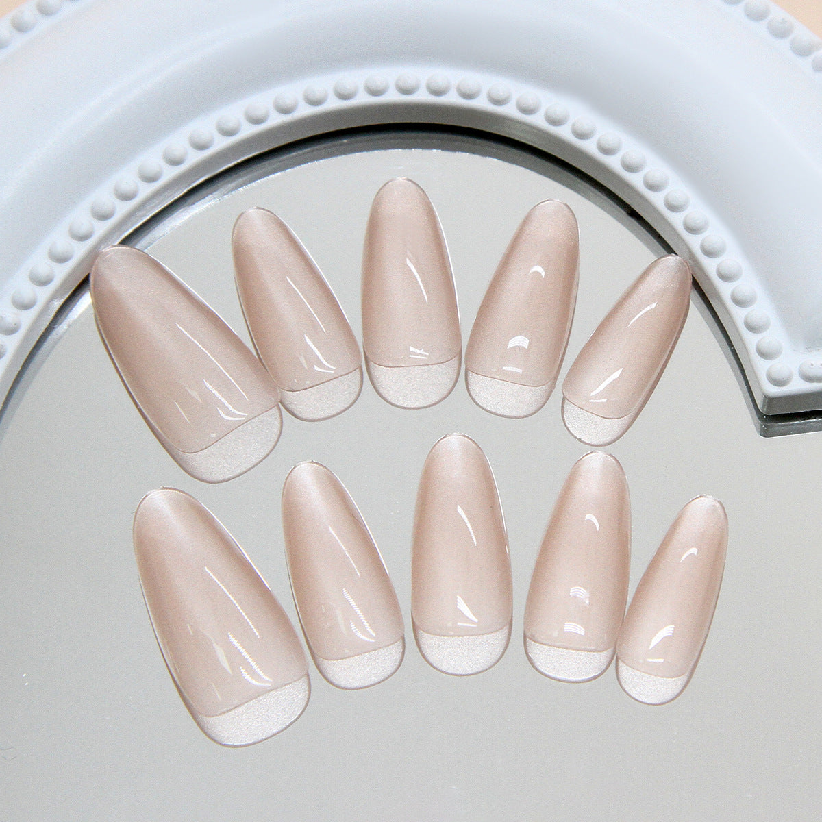 Elegant Delicacy Long Almond Blush Nails with Glossy French Tip Finish