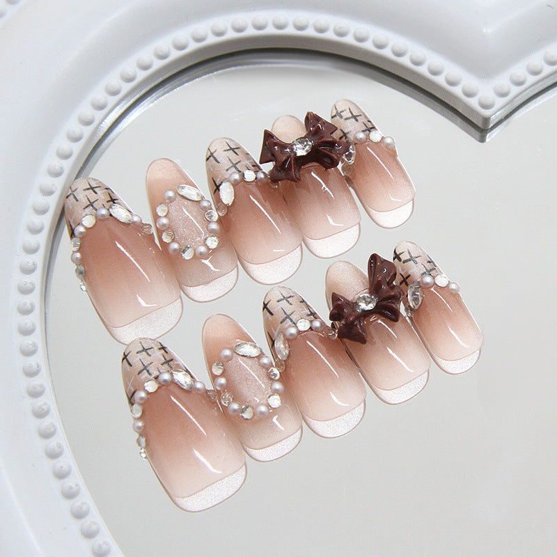 Charming Elegance Medium Almond Pink Press On Nail Set with Dazzling Pearl Accents and Unique Bow Embellishment