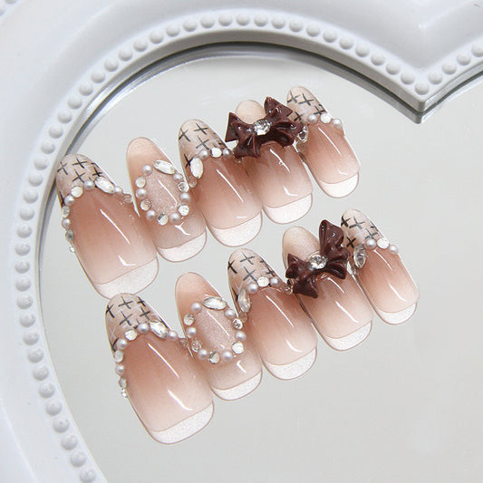 Charming Elegance Medium Almond Pink Press On Nail Set with Dazzling Pearl Accents and Unique Bow Embellishment