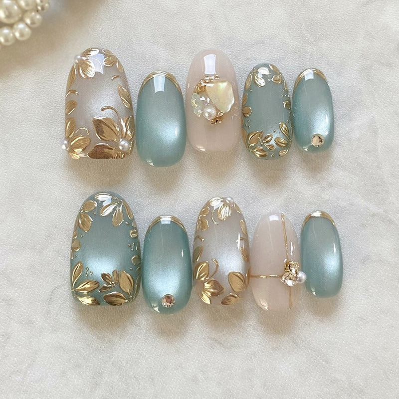 Whimsical Blossom Elegant Short Oval Teal and Soft Beige Press on Nail Set with Stunning Floral Design and Gemstone Accents