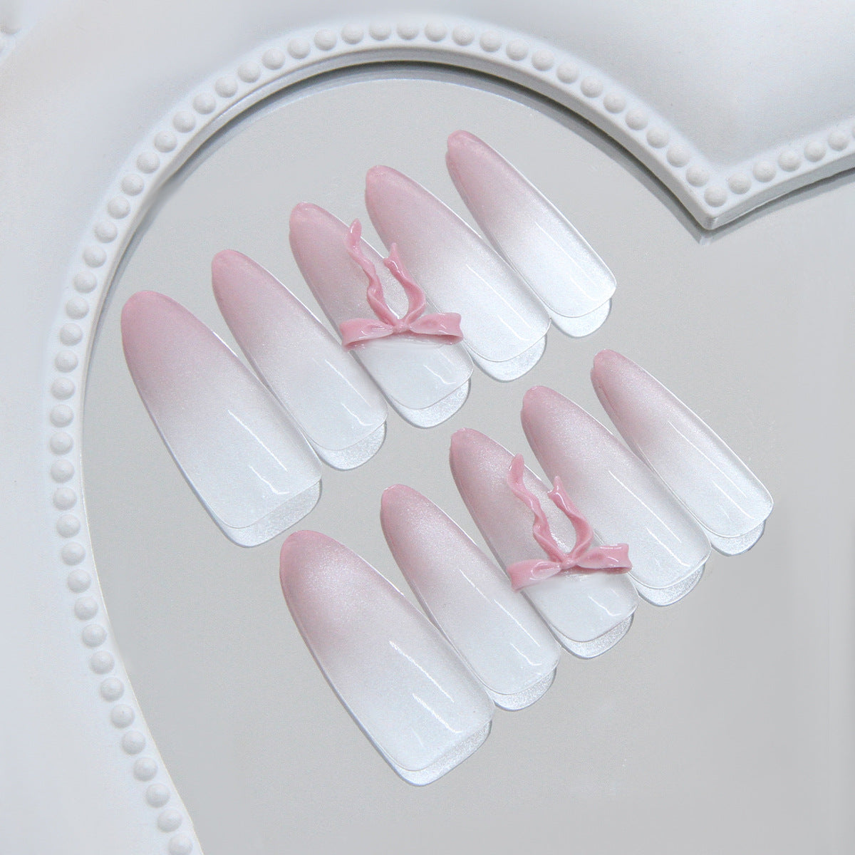 Whimsical Elegance Long Almond Ombre Pink and White Press-On Nail Set with Charming Bow Accents