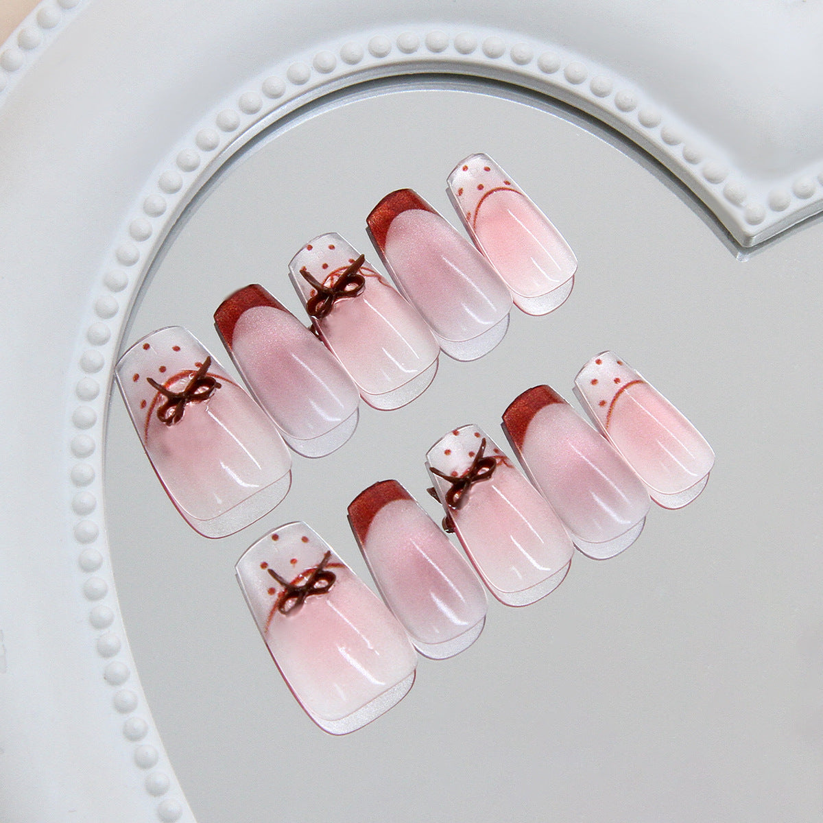 Whimsical Charm Sleek Medium Coffin Soft Pink Ombre Finish with Elegant Bow Detail Press On Nail Set