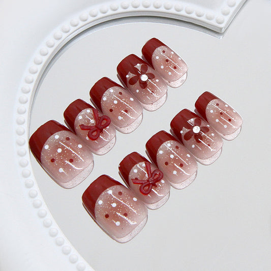Chic Holiday Elegance Medium Coffin Burgundy Ombre with Floral and Bow Accents Press On Nail Set