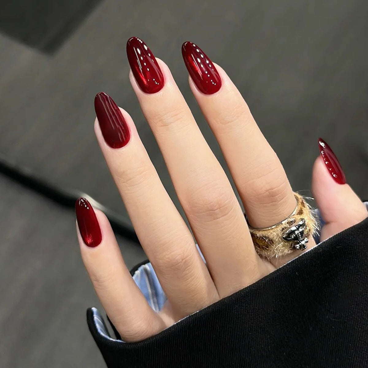 Elegant Enchantment Long Almond Shaped Deep Red Glossy Press On Nail Set With Unique Striped Design