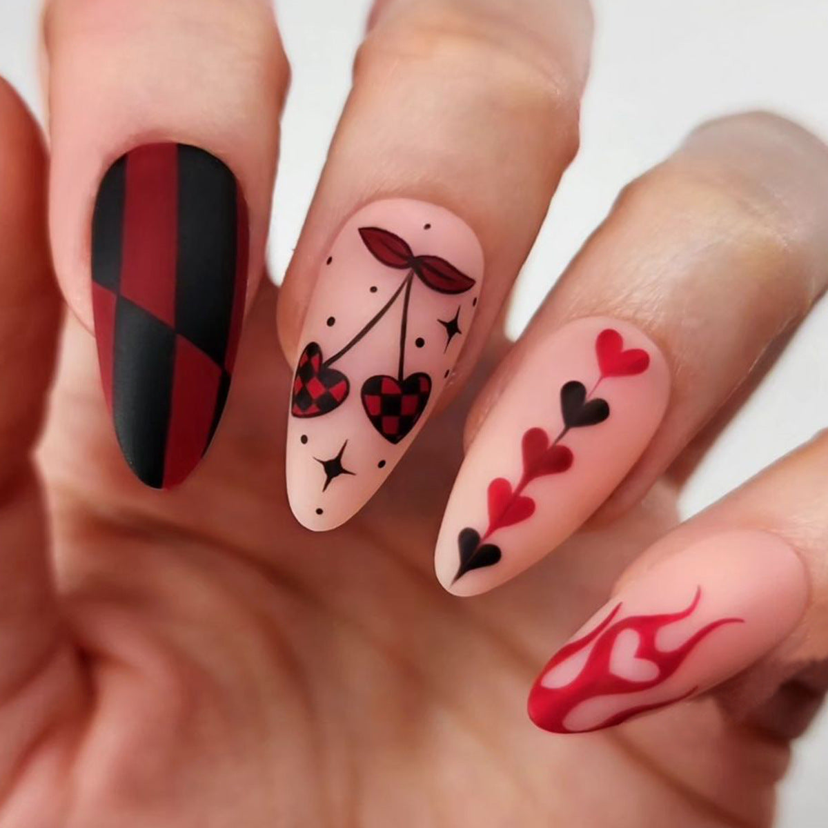 Romantic Charm Long Almond Red and Black Matte Press On Nail Set Featuring Whimsical Heart and Cherry Designs