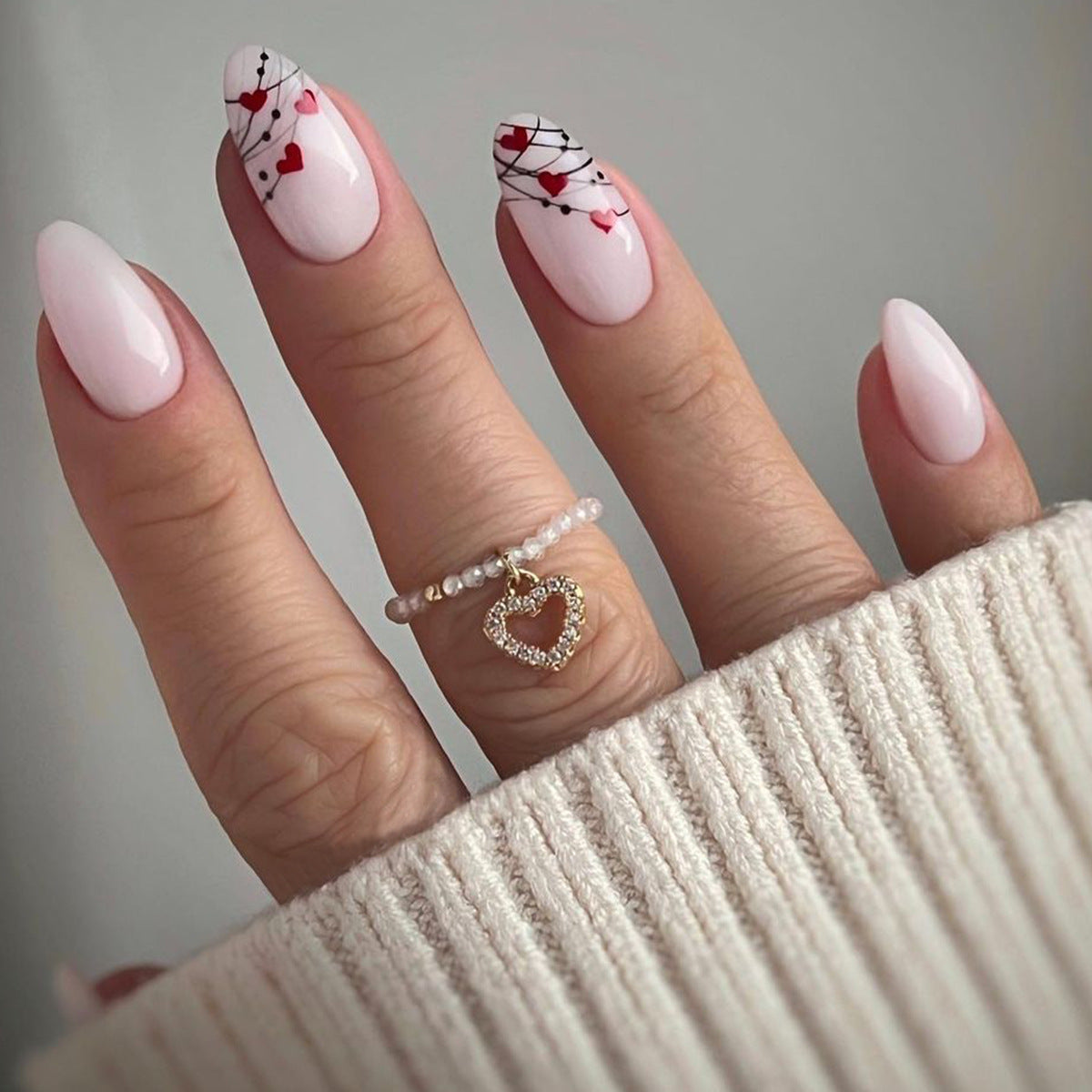 Romantic Bliss Medium Almond Shaped Light Pink Press On Nails with Heart Design