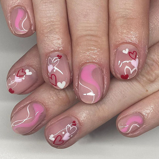 Romantic Heartfelt Dreamy Medium Round Press On Nail Set in Soft Pink with Whimsical Heart Designs